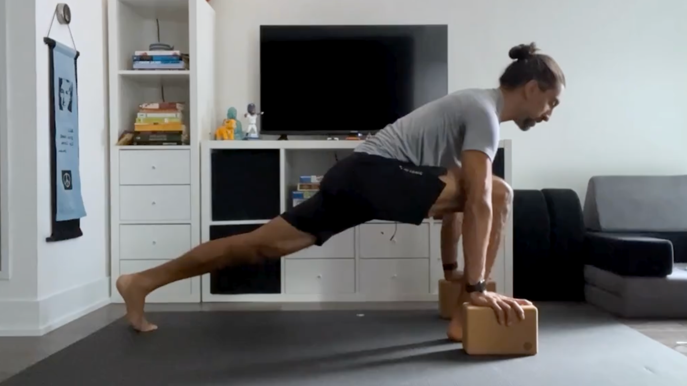 Yoga teacher Jaffer Hussain in Runner's Lunge, Utthita Ashwa Sanchalanasana in Sanskrit, one of his series of hips stretches